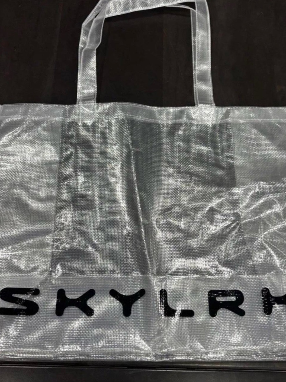 Skylrk shopper-Clear Shiny Logo tote by Justin Bieber. Coachella. Hailey Bieber